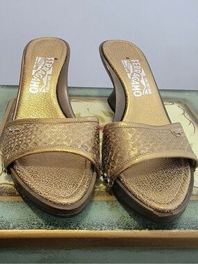 Salvatore Ferragamo Gold Metallic Slide Mules with Embossed Strap